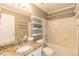 Bright bathroom with granite countertops, shelves, and a shower and tub combo at 5742 Corbon Crest Ln, Raleigh, NC 27612