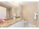 Bright bathroom featuring a granite countertop, white cabinets and a shower/tub combination at 5742 Corbon Crest Ln, Raleigh, NC 27612