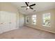 Bedroom features neutral walls, carpet floors, and a ceiling fan with overhead light at 5742 Corbon Crest Ln, Raleigh, NC 27612