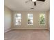 Spacious bedroom features neutral walls, carpet floors, and a ceiling fan with overhead light at 5742 Corbon Crest Ln, Raleigh, NC 27612
