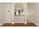 Dining room features views into the kitchen, hardwood floors and pendant lighting at 5742 Corbon Crest Ln, Raleigh, NC 27612