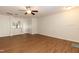 Spacious living room boasting wood-look flooring and a view of the kitchen with a breakfast bar at 5742 Corbon Crest Ln, Raleigh, NC 27612