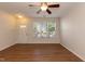 Inviting living space featuring wood-look floors, a ceiling fan, and a bright window at 5742 Corbon Crest Ln, Raleigh, NC 27612