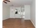 Spacious living room offering wood-look flooring, a view into the dining, and natural light at 5742 Corbon Crest Ln, Raleigh, NC 27612