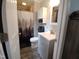 This newly remodeled bath features white fixtures and neutral surroundings at 623 Glenwood Dr, Sanford, NC 27330