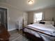 This lovely bedroom has wood-look floors and is well-lit at 623 Glenwood Dr, Sanford, NC 27330