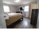 Comfortable bedroom with wood-look floors and neutral paint at 623 Glenwood Dr, Sanford, NC 27330