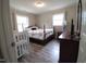 Cozy bedroom with wood-look floors, and well-lit with natural light at 623 Glenwood Dr, Sanford, NC 27330
