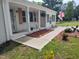 Close-up of the front porch with white columns, brick accents and decorative elements at 623 Glenwood Dr, Sanford, NC 27330