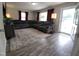 Inviting living room with a large sectional sofa and hardwood floors at 623 Glenwood Dr, Sanford, NC 27330
