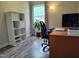 Bright office space with modern desk, shelves, and comfortable rolling chair at 623 Glenwood Dr, Sanford, NC 27330