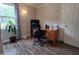 Well-lit home office with desk, storage, and view of the outdoors at 623 Glenwood Dr, Sanford, NC 27330