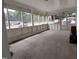 Spacious sunroom surrounded by many windows at 623 Glenwood Dr, Sanford, NC 27330