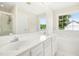 Bright bathroom with double sinks, a large mirror, and a separate shower and tub at 6521 Cablewood Dr, Raleigh, NC 27603
