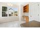 Charming breakfast nook features a built-in desk, storage, and natural light from the large windows at 6521 Cablewood Dr, Raleigh, NC 27603