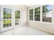 Bright breakfast nook with double doors leading to the backyard and large windows for natural light at 6521 Cablewood Dr, Raleigh, NC 27603