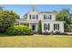 Charming two-story home with manicured lawn and lush landscaping at 6521 Cablewood Dr, Raleigh, NC 27603