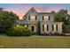 Charming two-story home with manicured lawn and lush landscaping at 6521 Cablewood Dr, Raleigh, NC 27603