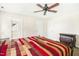 Bright main bedroom with a ceiling fan and access to the en suite bath and walk-in closet at 6521 Cablewood Dr, Raleigh, NC 27603