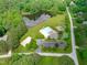 Aerial view of community amenities including pool, sand volleyball court, playground and pond at 677 Juliette Ct, Creedmoor, NC 27522