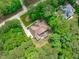 Overhead shot of the craftsman-style home, surrounded by lush greenery and neighborhood streets at 677 Juliette Ct, Creedmoor, NC 27522