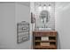 Stylish bathroom featuring a vessel sink on a vintage vanity, wainscoting, and modern fixtures at 677 Juliette Ct, Creedmoor, NC 27522