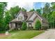 Beautiful craftsman style home with stone accents, neutral siding and manicured landscaping in a desirable neighborhood at 677 Juliette Ct, Creedmoor, NC 27522