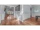 Bright foyer with hardwood floors, wainscoting, and views into the living room at 677 Juliette Ct, Creedmoor, NC 27522