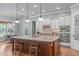 Kitchen features granite island, pendant lights, and stainless steel appliances at 677 Juliette Ct, Creedmoor, NC 27522