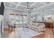 Bright living room features a large window, with a comfortable seating area and fireplace at 677 Juliette Ct, Creedmoor, NC 27522