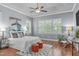 Spacious main bedroom with tray ceiling, large windows, and hardwood floors at 677 Juliette Ct, Creedmoor, NC 27522