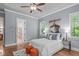 Lovely main bedroom with hardwood floors, light blue walls, and plenty of natural light at 677 Juliette Ct, Creedmoor, NC 27522