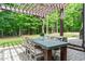 Charming pergola with outdoor seating, ideal for dining and entertaining in the backyard at 677 Juliette Ct, Creedmoor, NC 27522