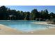 Large community swimming pool featuring clear, inviting water and lounge seating at 677 Juliette Ct, Creedmoor, NC 27522