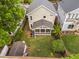 Aerial view of the backyard featuring a screened-in porch and a large, grassy yard at 711 Hinsdale St, Raleigh, NC 27605