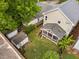 Aerial view of the backyard featuring a shed, a screened-in porch and a grassy yard at 711 Hinsdale St, Raleigh, NC 27605