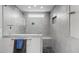 Modern bathroom with glass enclosed shower featuring a bench, rain shower head, and mosaic tile floor at 711 Hinsdale St, Raleigh, NC 27605