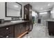 Modern bathroom featuring dual sink vanity with lots of storage, large mirror and spacious shower at 711 Hinsdale St, Raleigh, NC 27605