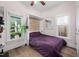 Comfortable bedroom with a murphy bed, natural light, and hardwood floors at 711 Hinsdale St, Raleigh, NC 27605