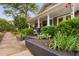Charming home with gray siding, shingle detail, blue door, and front yard landscaping at 711 Hinsdale St, Raleigh, NC 27605