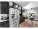 Modern kitchen with stainless steel appliances, dark cabinetry, and plenty of counter space at 711 Hinsdale St, Raleigh, NC 27605