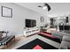 Bright living room features modern décor, hardwood floors, and an open layout at 711 Hinsdale St, Raleigh, NC 27605