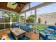 Relaxing screened porch with comfortable seating and a view of the backyard at 711 Hinsdale St, Raleigh, NC 27605