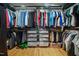 Well-organized walk-in closet with hanging racks, shelves, and drawers for ample storage at 711 Hinsdale St, Raleigh, NC 27605