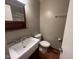 Bathroom features a vintage sink with a large counter and tiled flooring at 727 Queens Ave, Dunn, NC 28334