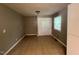 Neutral-toned bedroom featuring tile flooring and a storage closet at 727 Queens Ave, Dunn, NC 28334