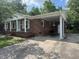 Charming brick home featuring a convenient carport and well-maintained front yard, perfect for comfortable living at 727 Queens Ave, Dunn, NC 28334