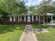 Charming brick home with well-maintained lawn and a covered parking area at 727 Queens Ave, Dunn, NC 28334