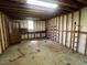 Interior of the garage with exposed framing and shelves at 727 Queens Ave, Dunn, NC 28334
