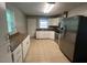 Bright kitchen with stainless steel appliances and plenty of counter space at 727 Queens Ave, Dunn, NC 28334